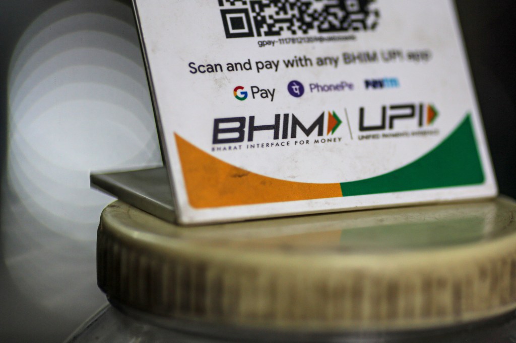A store advertises the use of the Bharat Interface for Money (BHIM) payment app in Mumbai, India, on Saturday, July 17, 2021. India had a record $6.3 billion of funding and deals for technology startups in the second quarter, while funding to China-based companies dropped 18% from a peak of $27.7 billion in the fourth quarter of 2020, according to data from research firm CB Insights. Photographer: Dhiraj Singh/Bloomberg via Getty Images