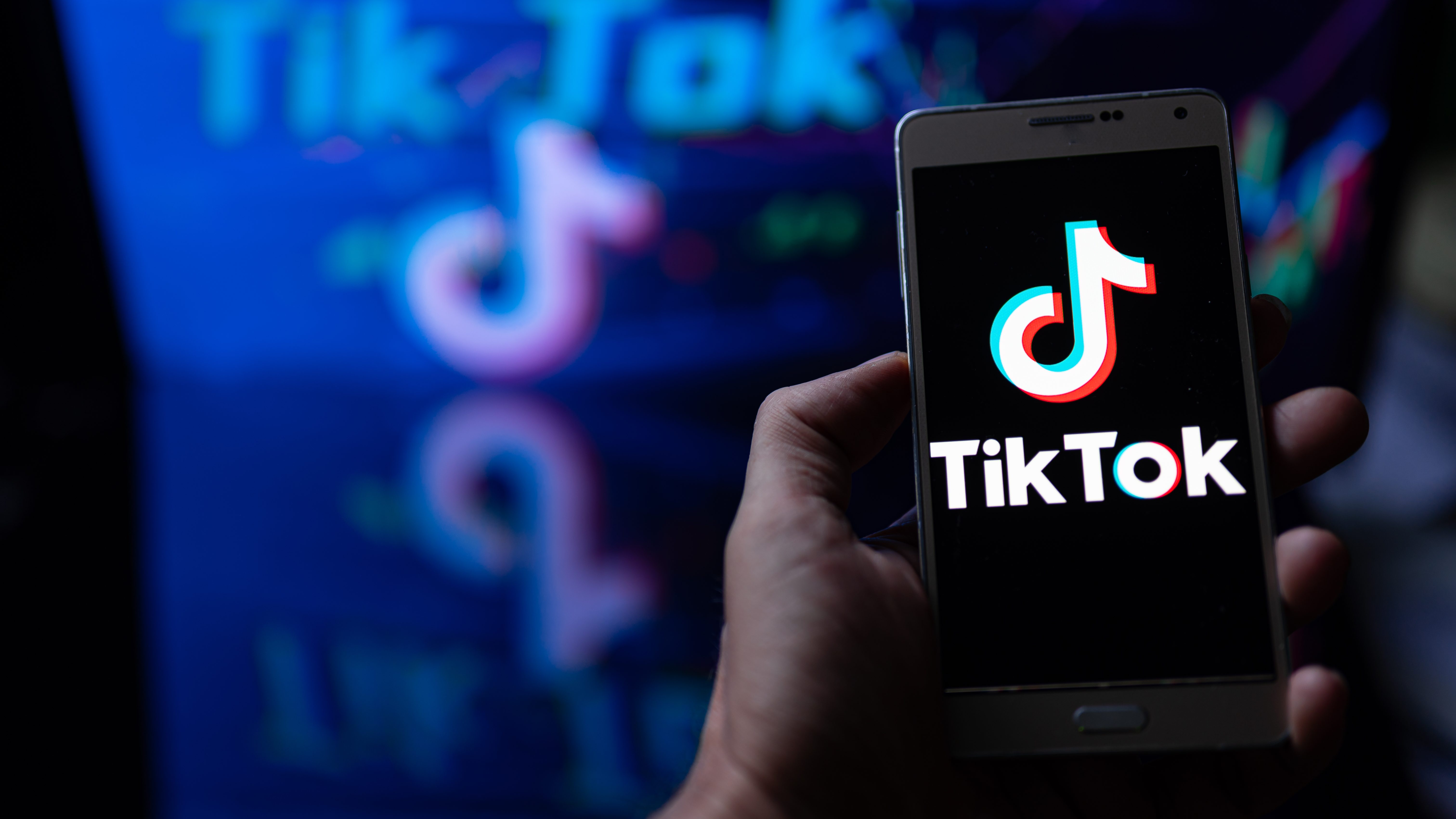 TikTok logo displayed on a smartp،ne