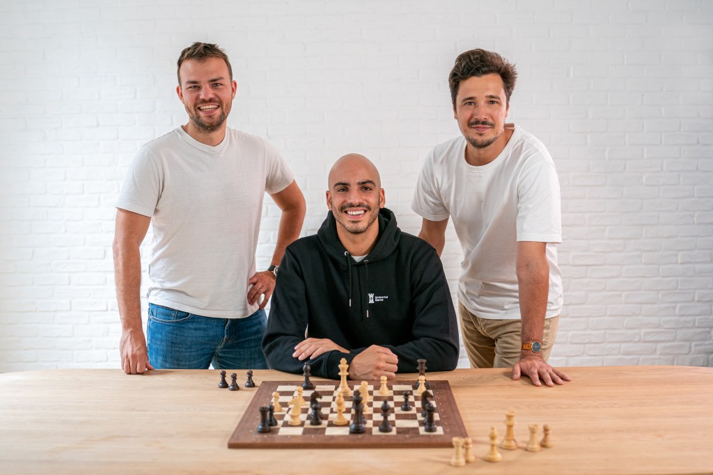 3 men at chess board