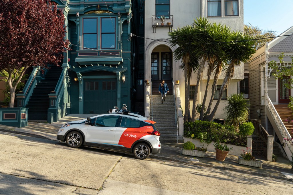 The GM Cruise Chevy Bolt is parked on a hill in San Francisco
