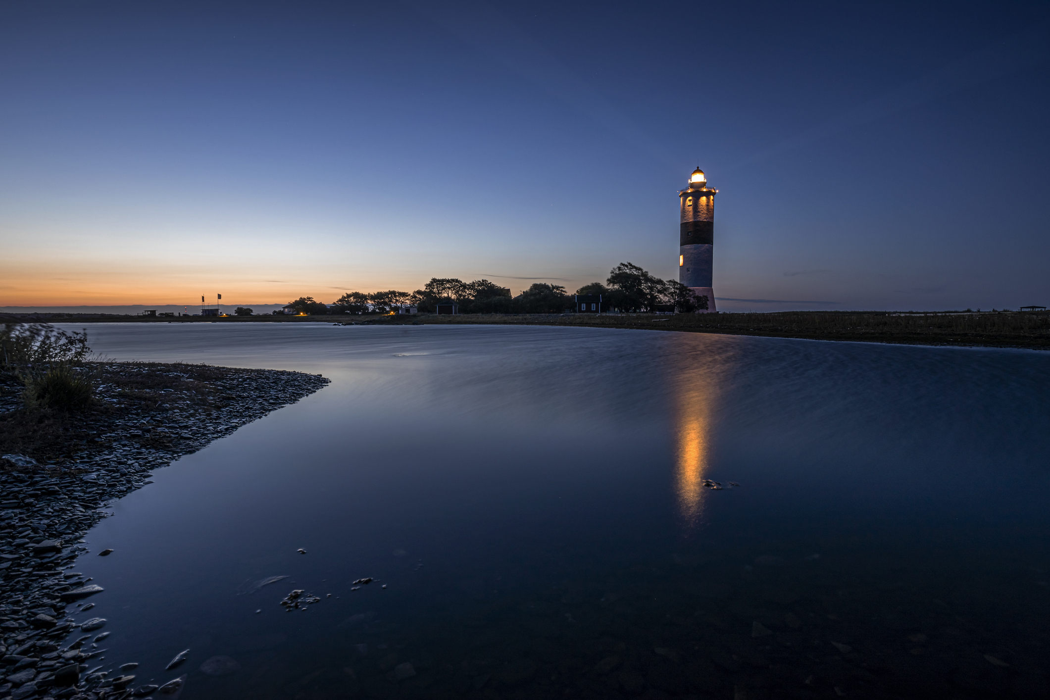 Illuminated lighthouse at dusk, Åland, Sweden