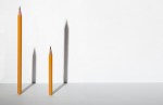 Two pencils and it shadows. Leadership, ambition and teamwork business concept.