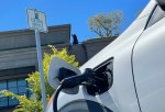 "An electric car charges at a mall parking lot on June 27, 2022 in Corte Madera, California."