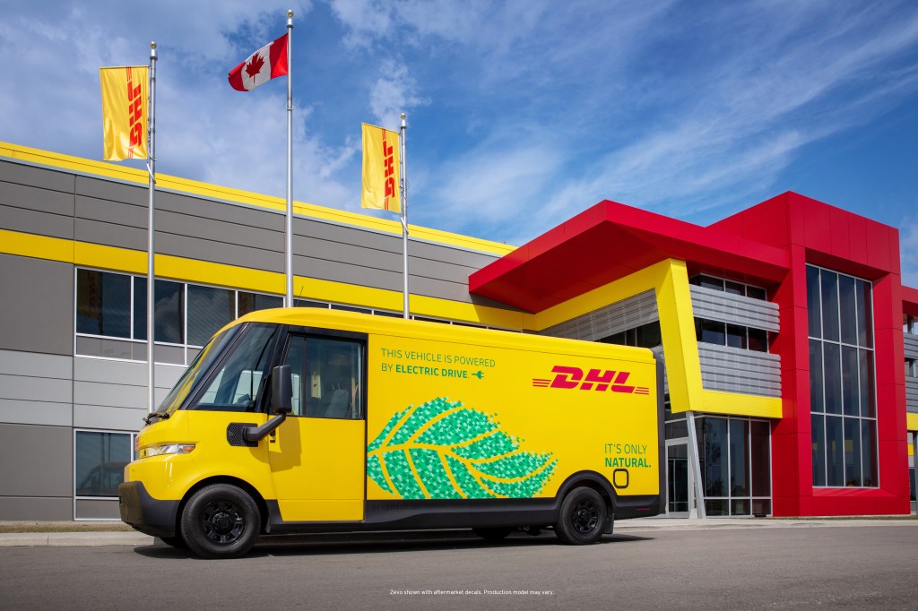 BrightDrop's electric delivery van pictured from the side, in yellow, with DHL Express logo on it