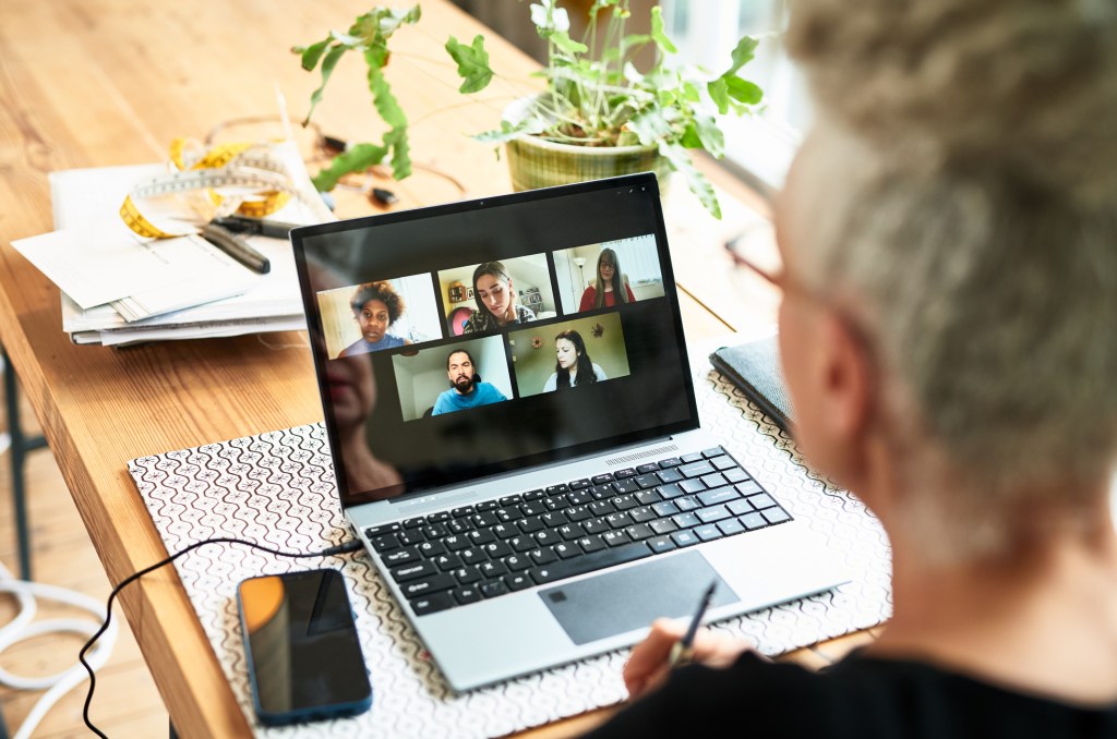 Woman on a laptop during a virtual meeting
