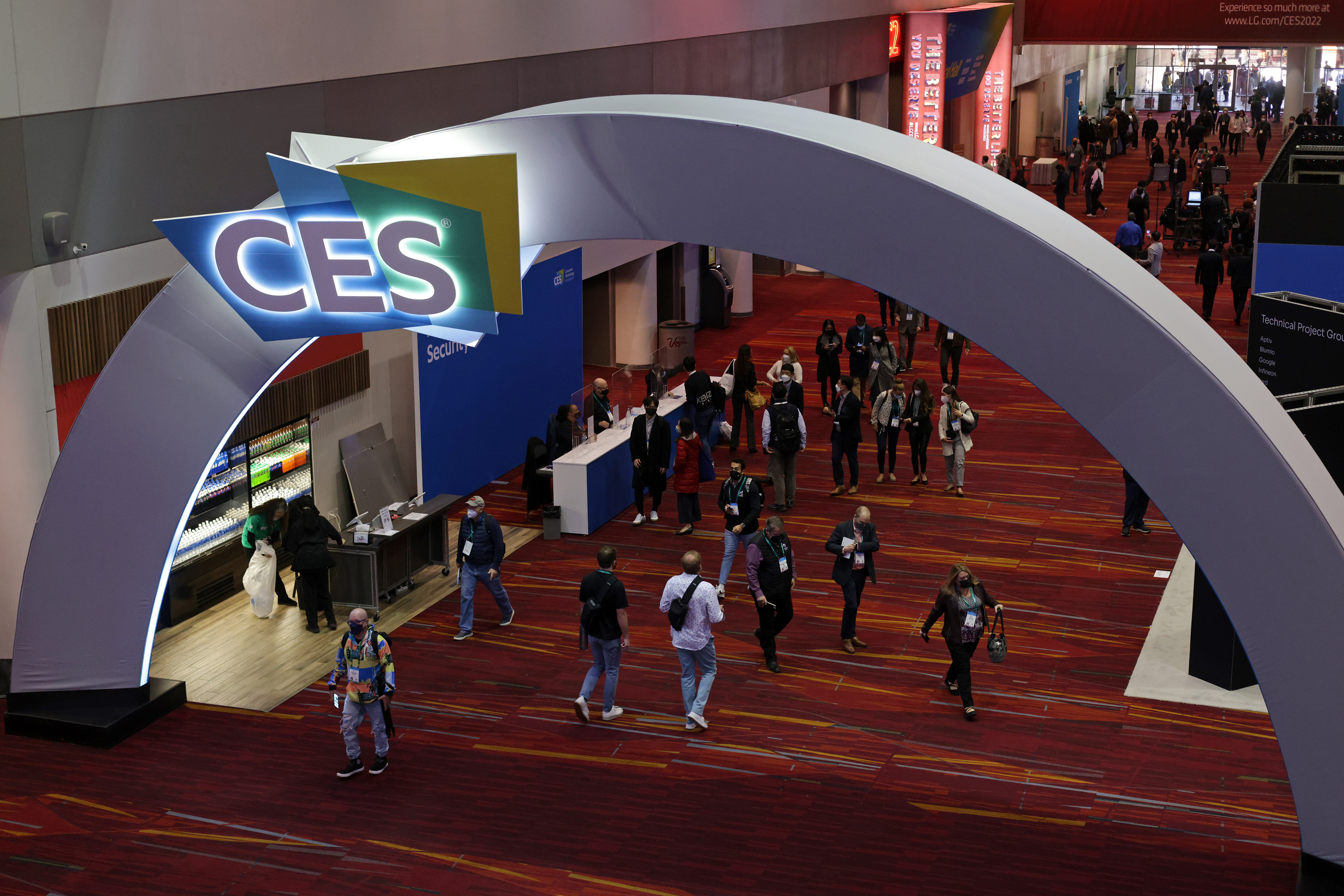 LAS VEGAS, NEVADA - JANUARY 5: Attendees walk through a hallway at the Las Vegas Convention Center on Day 1 of CES 2022, January 5, 2022 in Las Vegas, Nevada.  CES, the world's largest annual consumer technology trade show, will be held in person through January 7, with some companies deciding to just attend mostly or cancel attendance due to concerns about large increase in COVID-19 cases.  (Photo by Alex Wong/Getty Images)