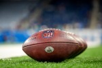 NFL logo footballs sitting on field