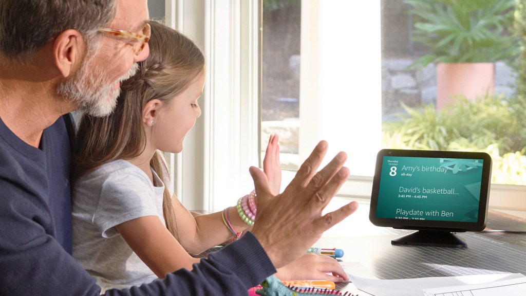 Father and daughter demonstrating new gesture features on an Amazon Echo Show