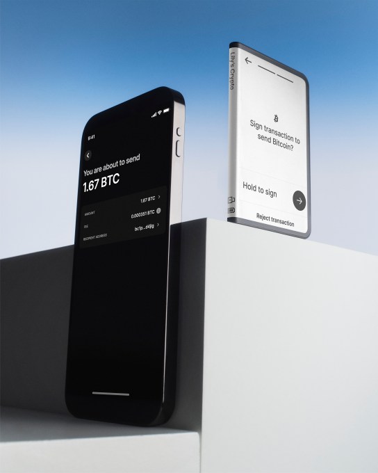 An image of an iPhone next to the Ledger Stax crypto hardware wallet