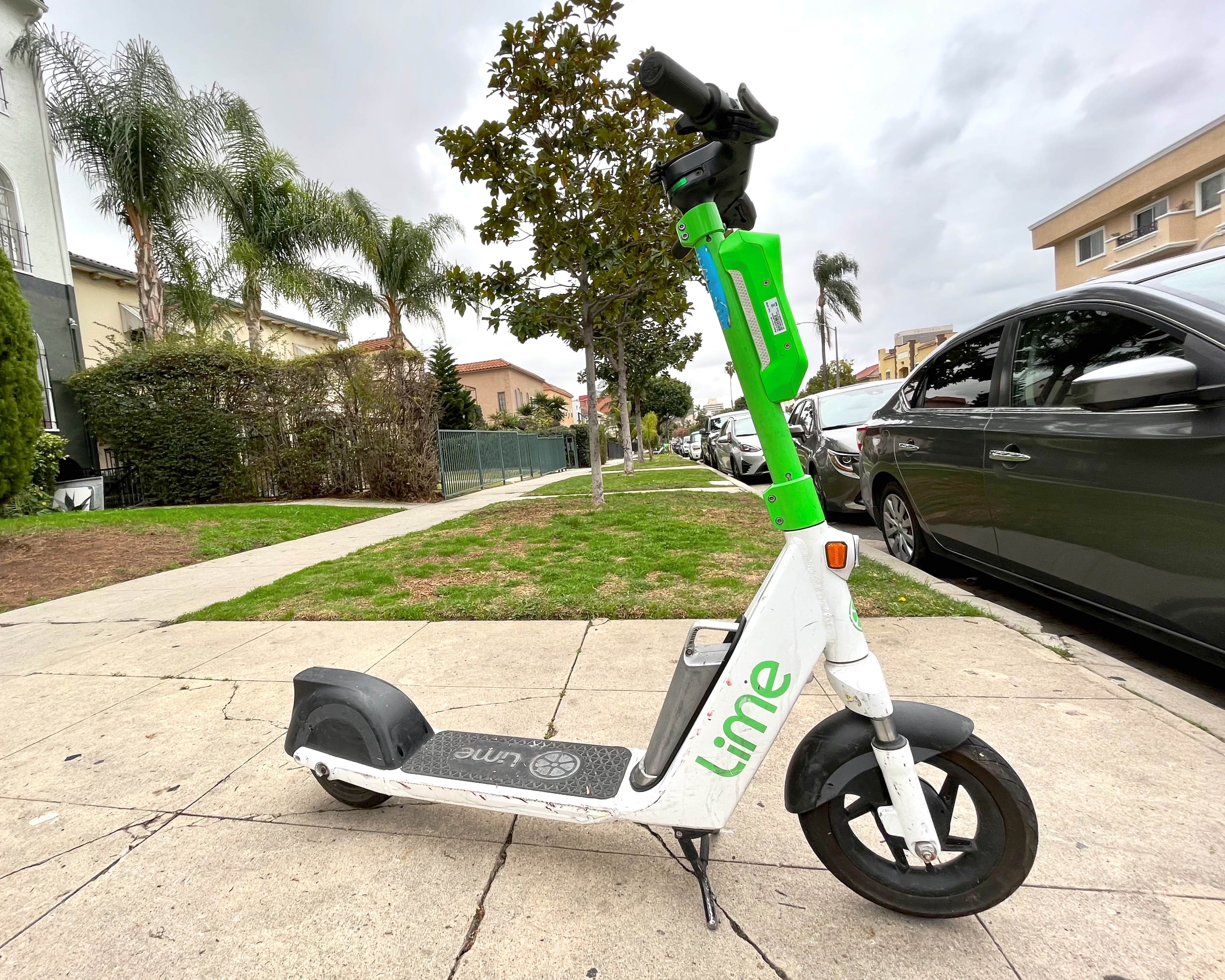 A shared scooter was parked on a sidewalk, Koreatown, Los Angeles.