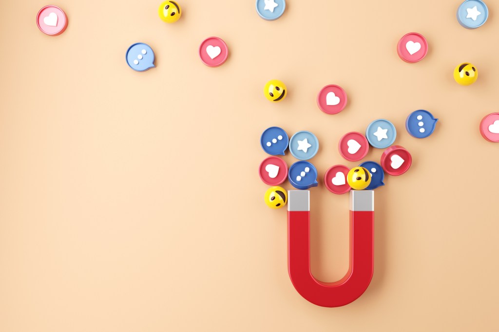 Social media app marketing concept. Attract (emoji, like, love, star, comment icon) with giant magnet, 3d rendering. copy space