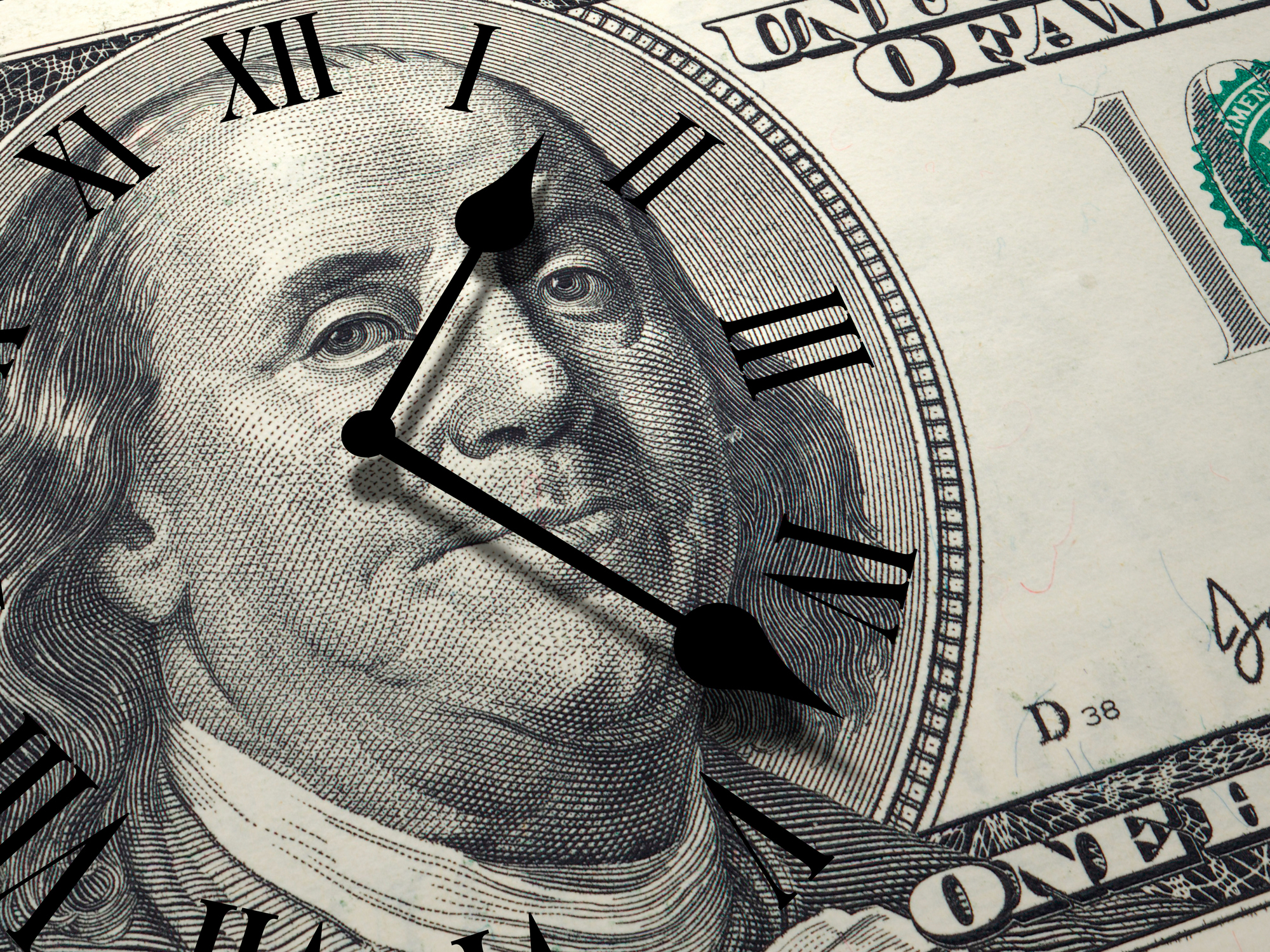 Time is money concept with hundred dollar bill and clock face on it.