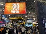 A Caterpillar sign at CES 2023 reads, "JOIN US AS WE BUILD A BETTER WORLD."