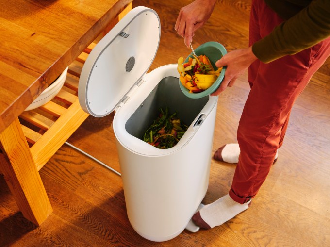 Food is disposed of in a Mill food waste bin.