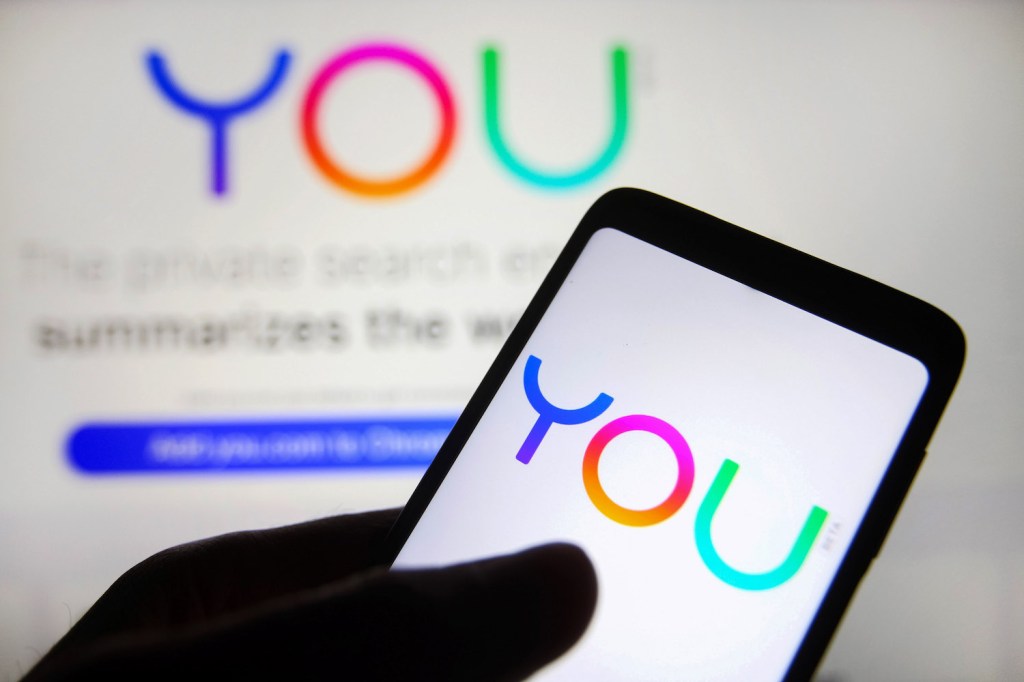 UKRAINE - 2021/11/10: In this photo illustration, a You.com logo of a startup is seen on a smartphone screen with its website in the background. (Photo Illustration by Pavlo Gonchar/SOPA Images/LightRocket via Getty Images)