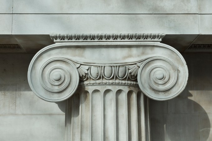 detailed carving on a pillar supporting a building
