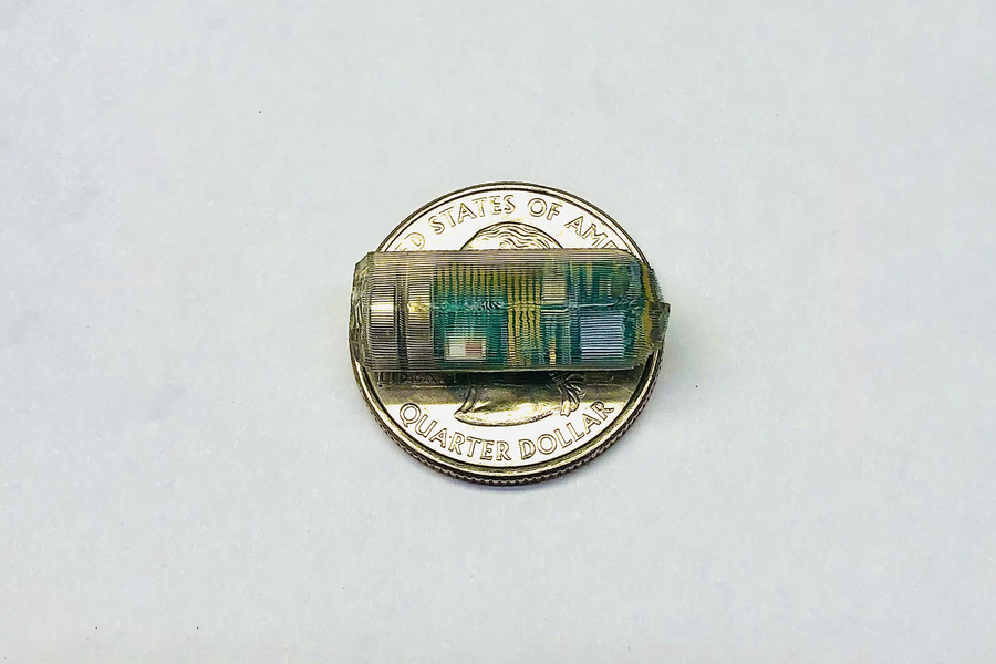 Ingestible medical sensor on a penny to show size