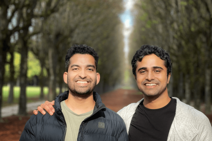 Chronicle founders Mayuresh Patole and Tejas Gawande standing outside against a lane of trees