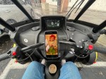 Sitting in Arcimoto's three-wheeled FUV