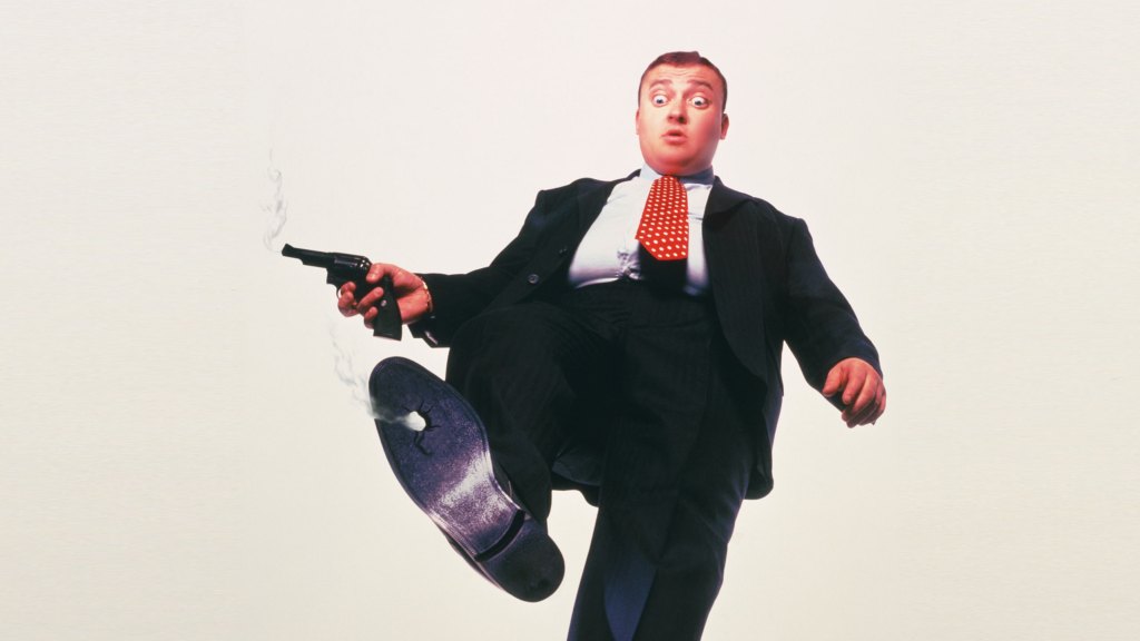 Businessman holding gun,bullet hole in shoe,upward view (Enhancement)