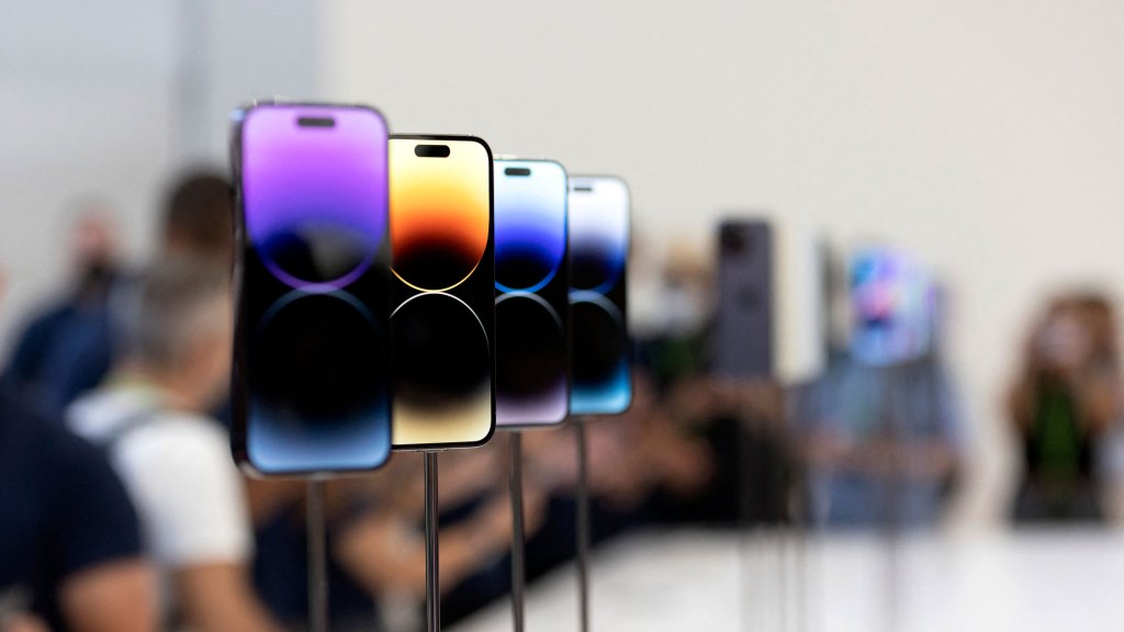 TOPSHOT - The new iPhone 14 and 14 Plus are shown during a new product launch event at Apple Park in Cupertino, California, on September 7, 2022. - Apple unveiled several new products including the new iPhone 14 and 14 Pro, and three Apple Watches and the new AirPod Pros during the event.  (Photo by Brittany Hossa-Small/AFP) (Photo by Brittany Hossa-Small/AFP via Getty Images)