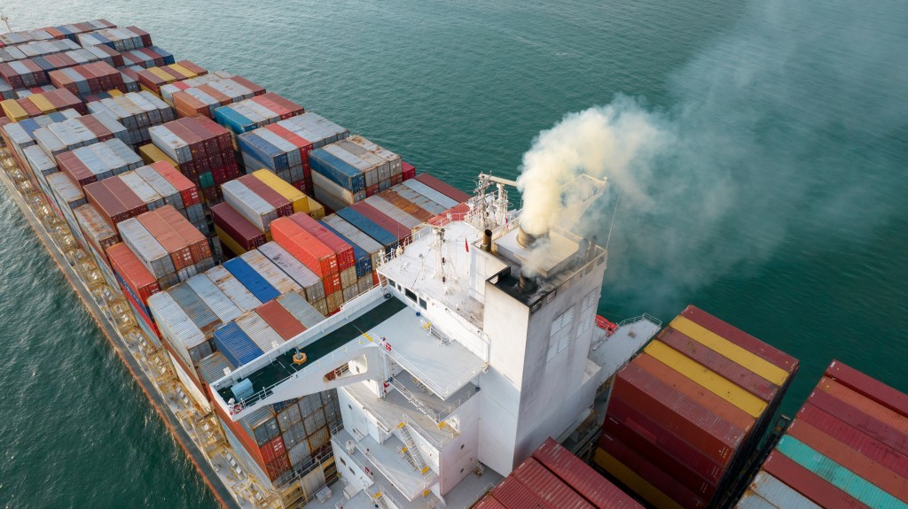 Pollution spews from a container ship.
