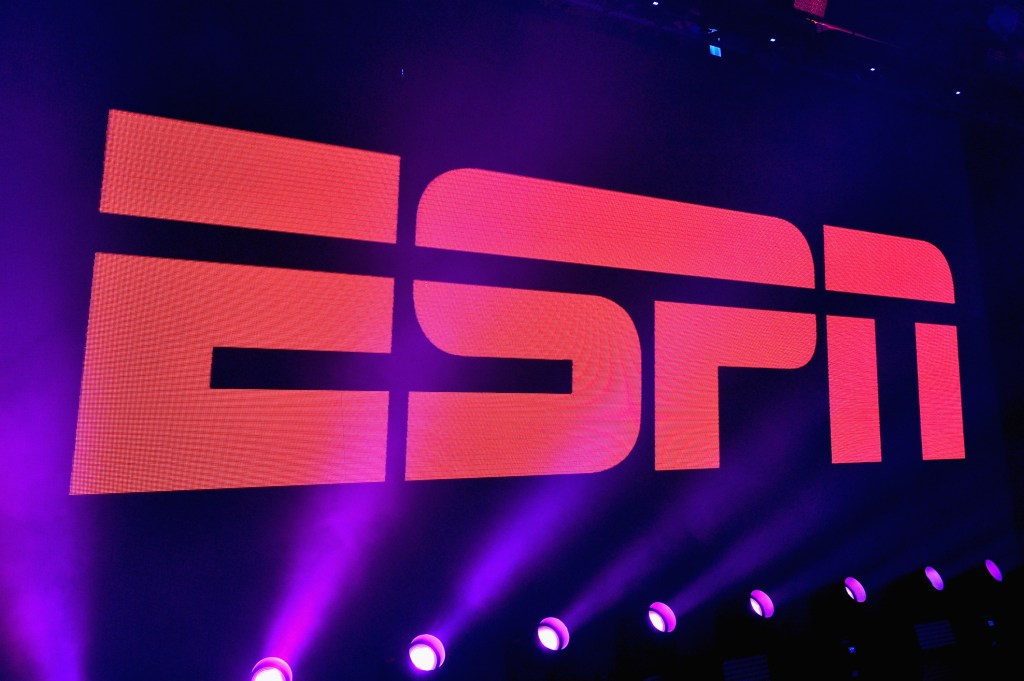 ESPN logo with purple lights shinning on it
