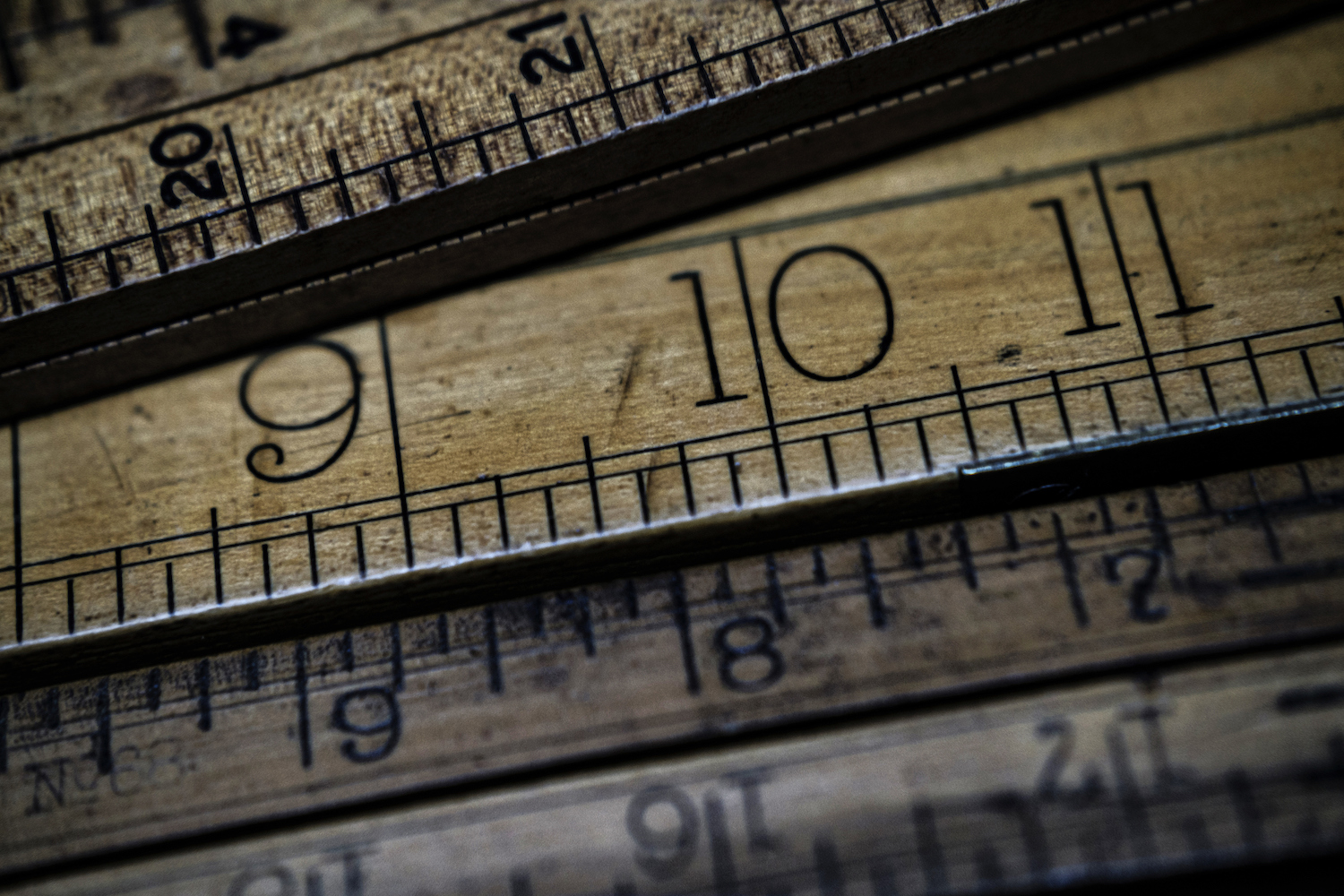 Close-up of several wooden rulers