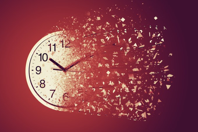 Time Management Concept : White wall clock break down and dispersion to particle.