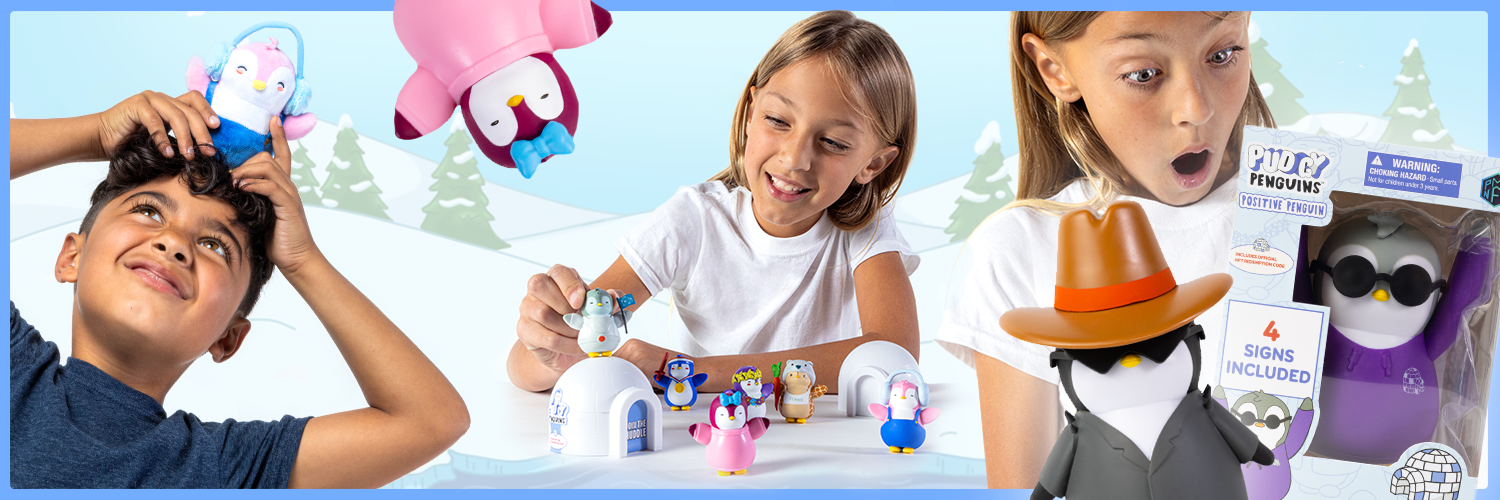 An image of a boy and a girl playing with the Pudgy Toys that look like penguins