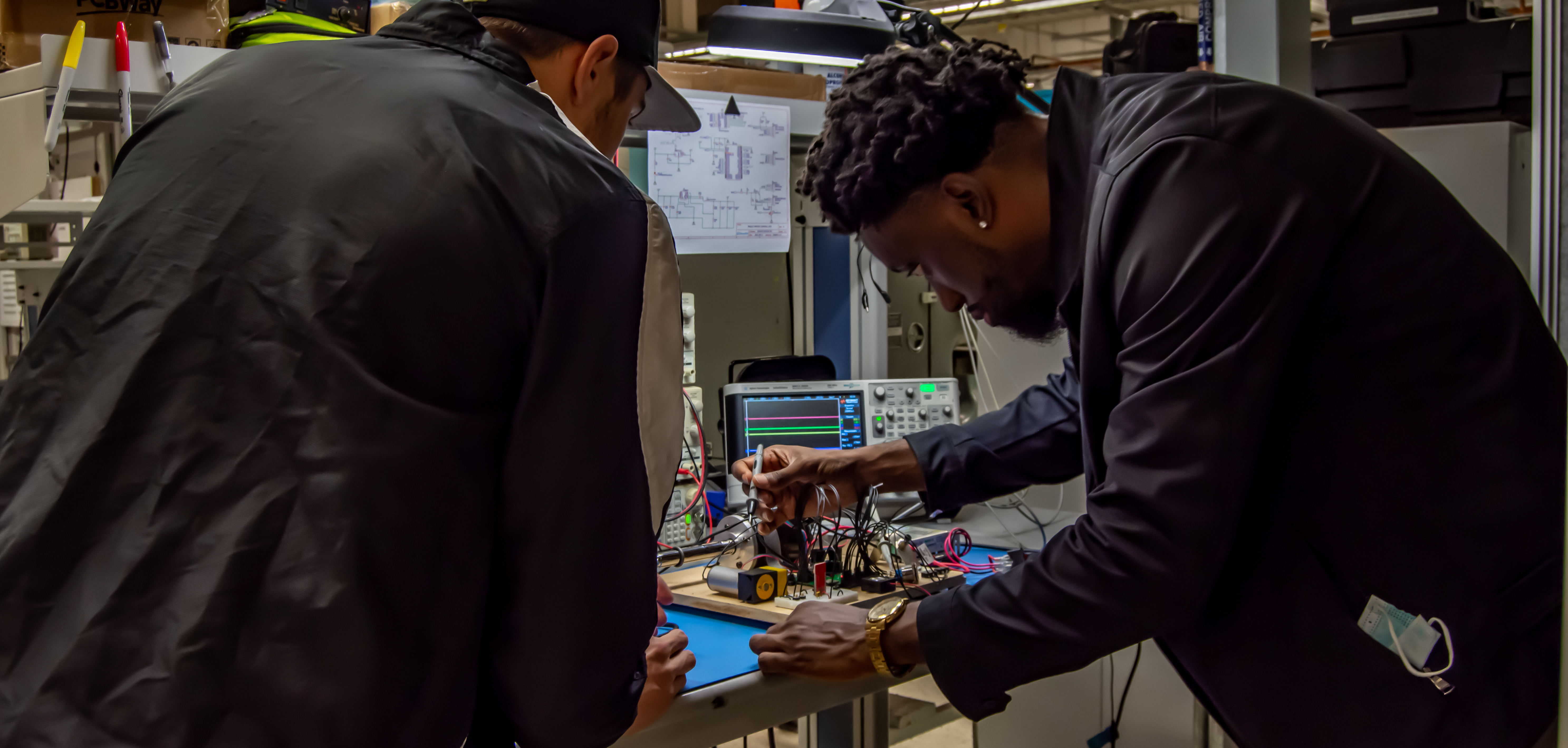 mHub members working in the accelerator's current electronics lab