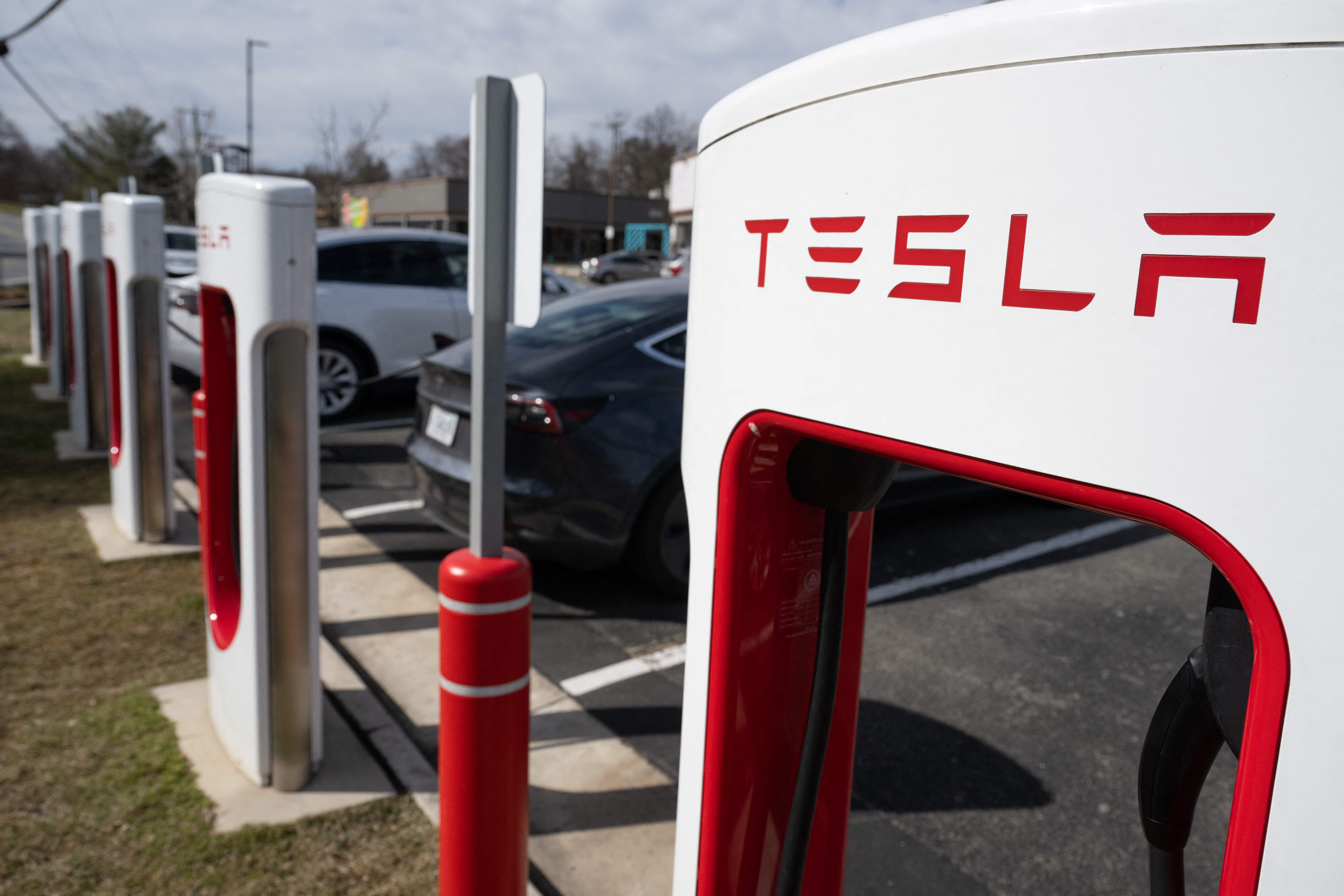 Tesla charging at a supercharger