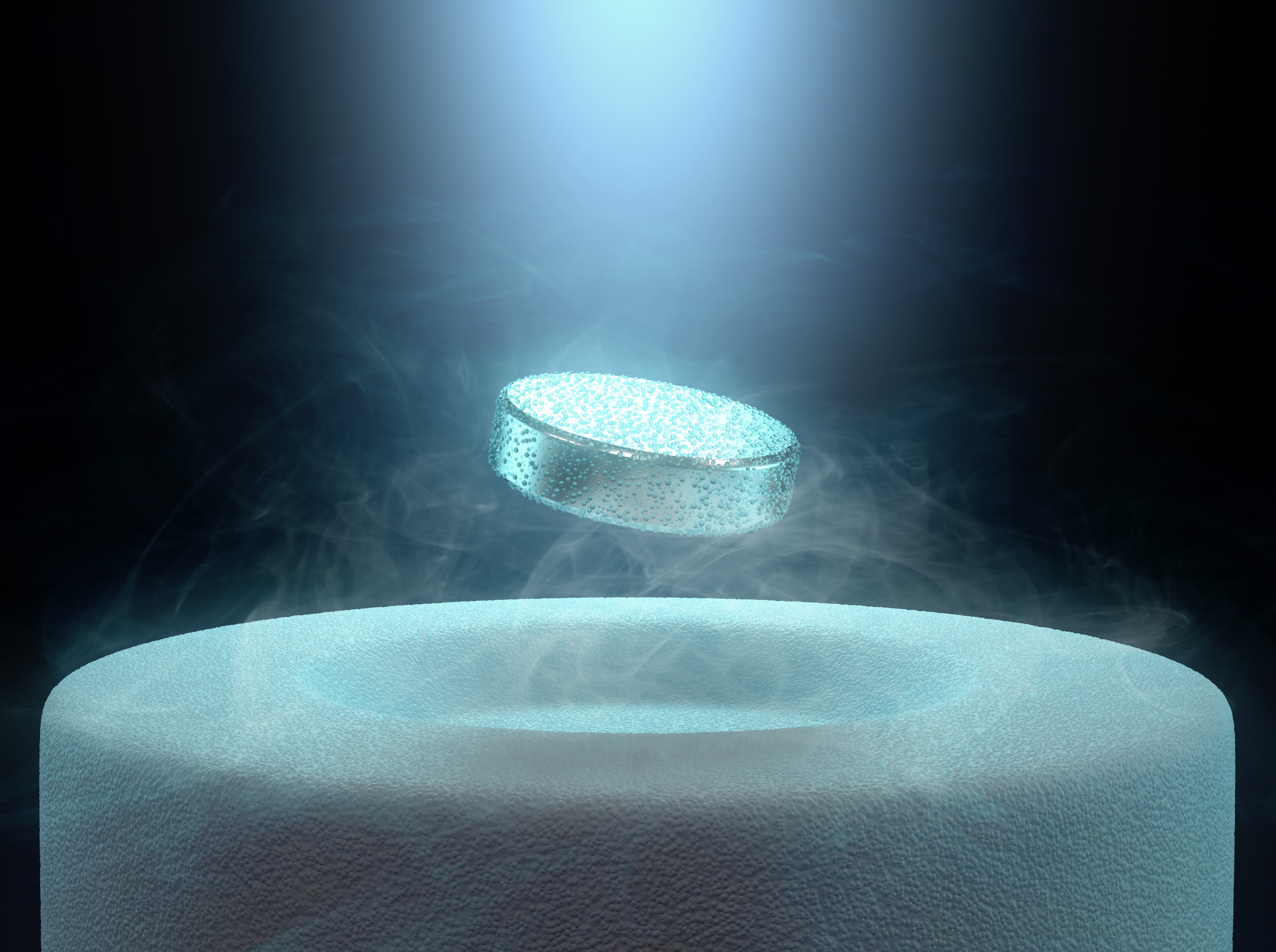 Illustration of a superconductor levitating above a magnet.