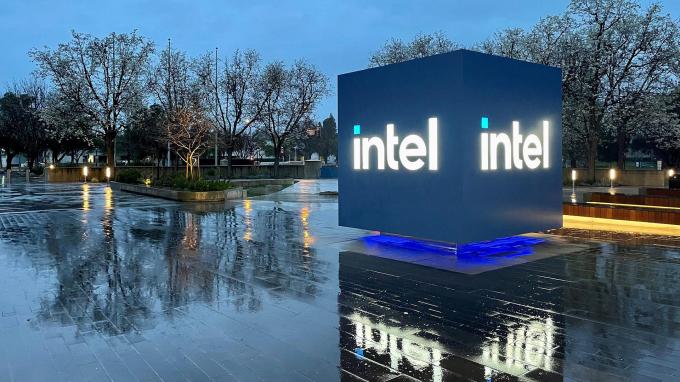 Intel Headquarters Robert Noyce Building in Santa Clara, California at night with Intel sign lit up.