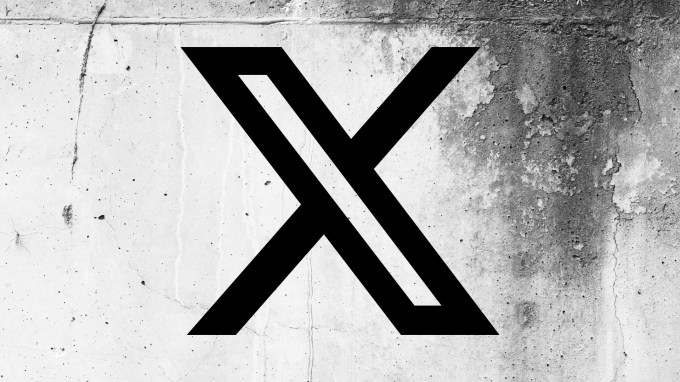 X (formerly Twitter) logo on a cracked wall