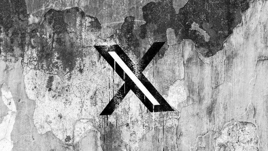 X logo (formerly Twitter) on a cracked wall