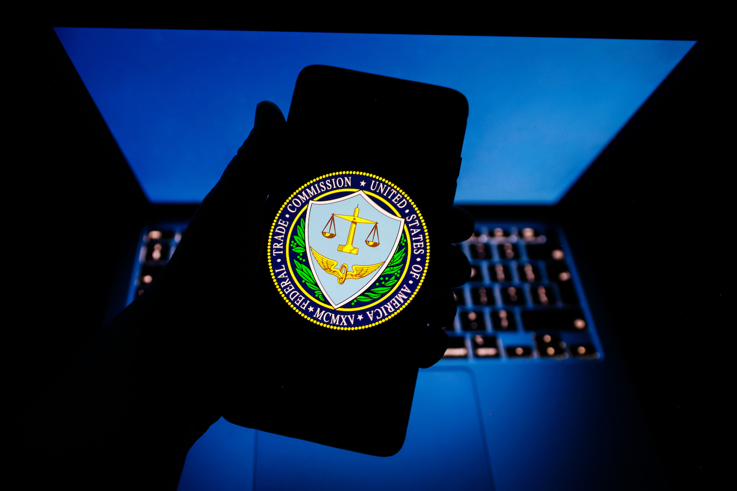 The Federal Trade Commission of the United States seal is displayed on a mobile phone screen for illustration photo. Krakow, Poland on February 2nd, 2023. (Photo by Beata Zawrzel/NurPhoto)
