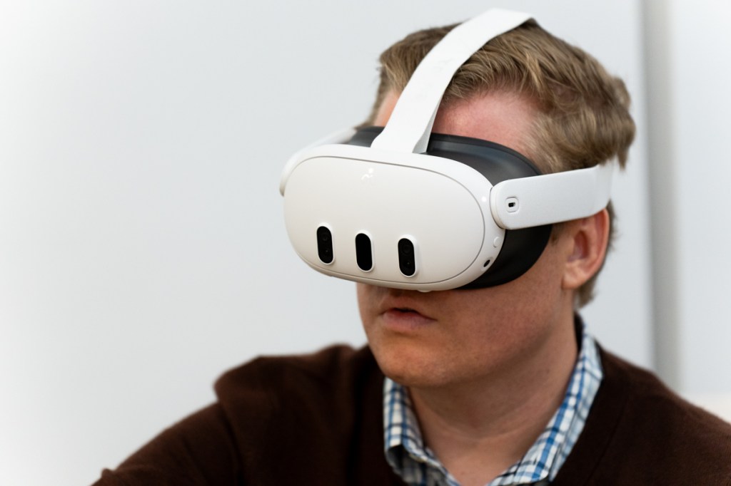 Man wearing the Meta Quest 3 mixed reality headset, viewed from the front