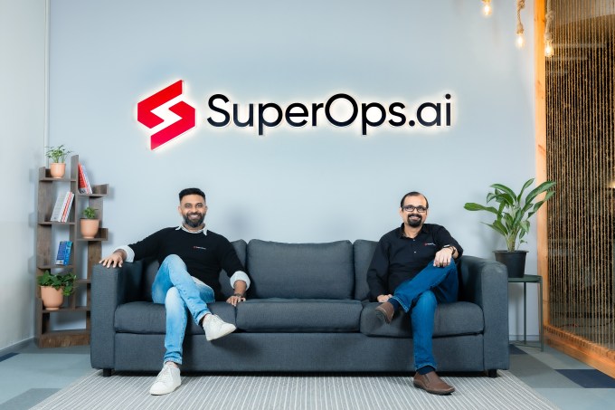 SuperOps.ai founders Arvind Parthiban and Jay Karumbasalam sitting on a sofa