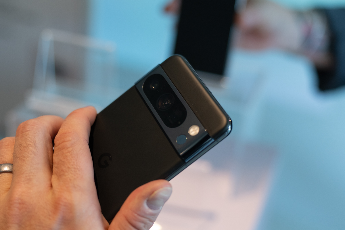 Google PIxel 8 Pro being held, showing the rear camera array