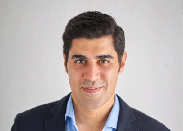 The head shot of Dr.  Parag Khanna, founder and CEO of Climate Alpha, is pictured on a white background