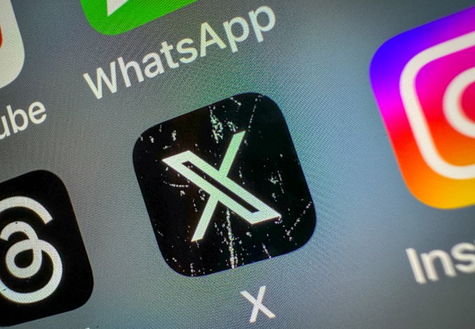 X icon on a smartphone screen