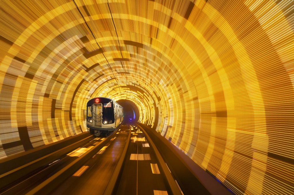 C 8th Avenue local moving subway train. Speeding train on New York City subway tracks.  A subway train passing through a motion blur tunnel at C-8th Street Local. New York City, New York State, USA (Photo: Juan Maria Coy Vergara/Getty Images)