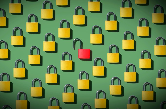 closed padlocks on a green background with the exception of one lock, in red, which is open, symbolizing poorly managed data breaches