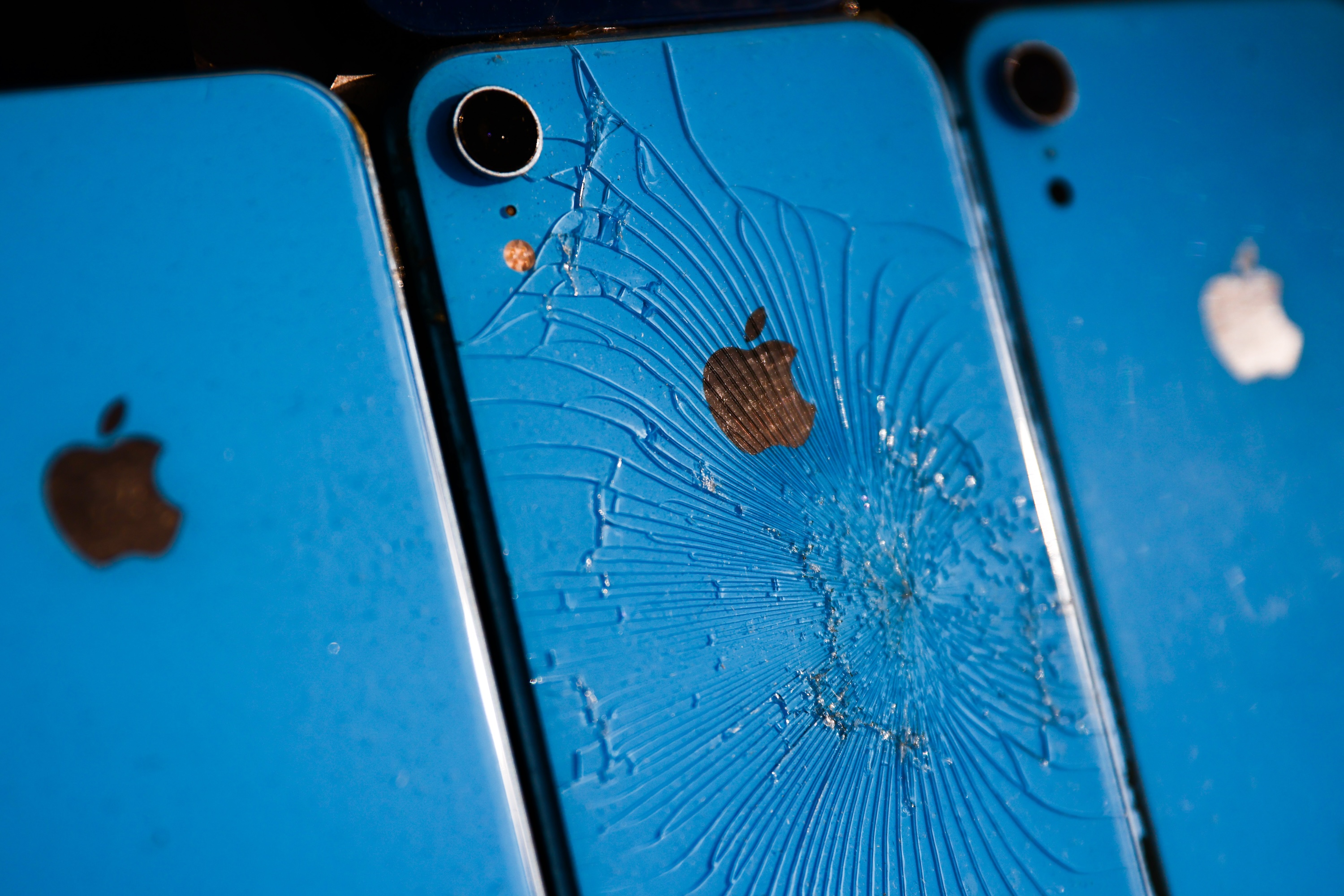 Smashed Iphones are seen during COP28 in Dubai, United Arab Emirates on November 30, 2023.