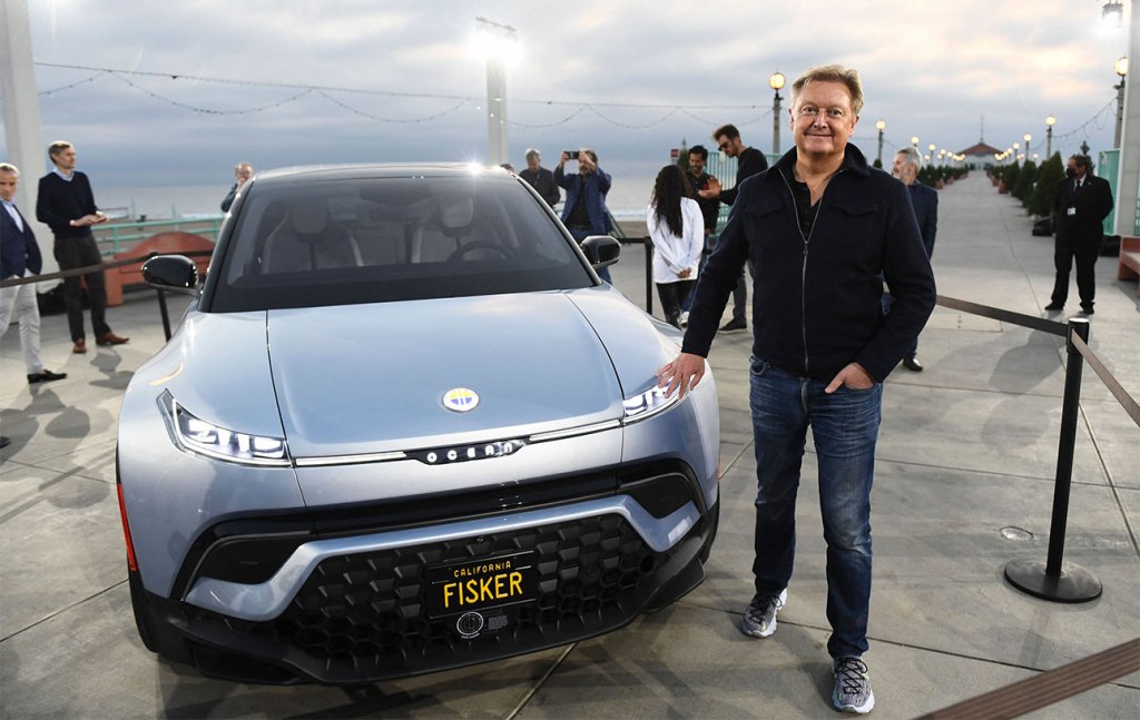 Henrik Fisker stands with the Fisker Ocean electric vehicle after it was unveiled at the Manhattan Beach Pier ahead of the Los Angeles Auto Show and AutoMobilityLA on November 16, 2021 in Manhattan Beach, California. (Photo by PATRICK T. FALLON/AFP via Getty Images)
